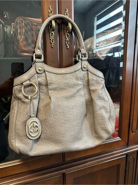 Gucci Taupe Embossed GG Hobo Bag with Gold-Tone Charm